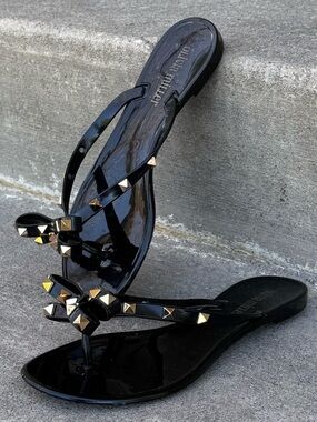 OLIVIA MILLER “RAVENNA” BLACK STUDDED BOW JELLY SANDALS